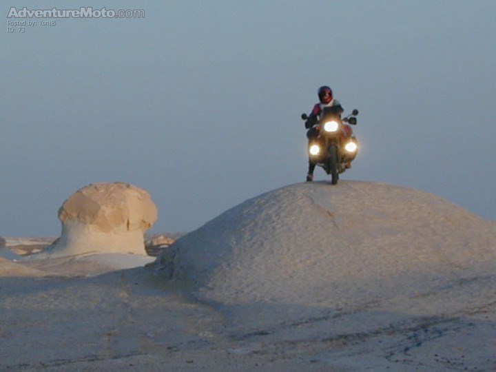 UFOing the desert, This shot by my friend Yakis Kidron(c). was taken while I was crossing some 25 km of surface covered with white solid rock that the wind and sand curved
fatastic shapes-"mushrooms" and small caps like this one, It was like riding on th