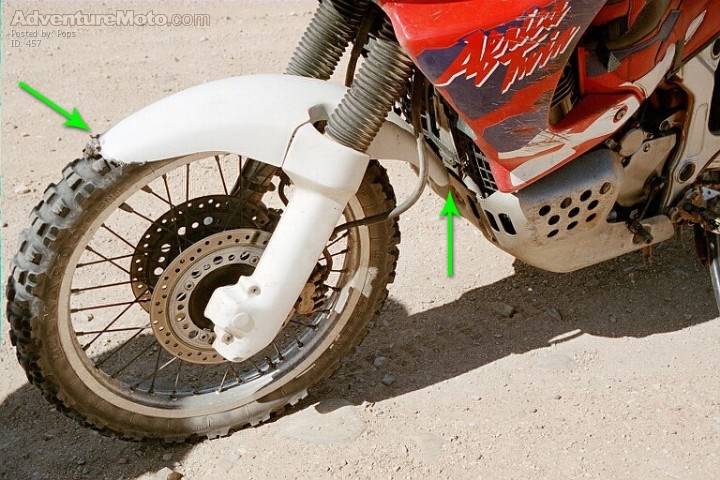 Design Fault - has this happened to your @? - This is what happens, when you go over a large bump, the suspension compresses a long way and the mudguard catches on the engine guard! It has happened to both Africa Twins on this trip. Instant brake on the f