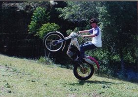 wheelie - a bit of practice with the old man in the back yard